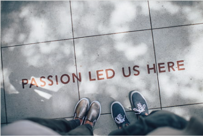 Passion Led Us Here written on concrete sidewalk